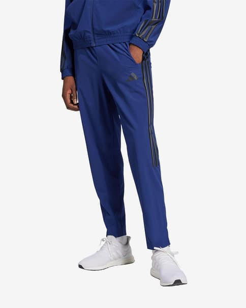 Pantalón largo adidas House of Tiro Woven azul marino